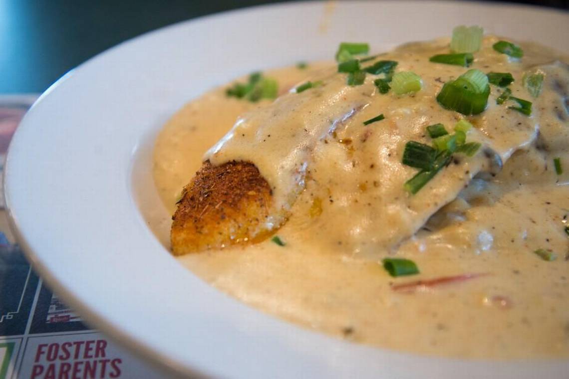 The Cajun Big Fish at Metro Diner is a blackened swai filet served over mashed potatoes with a mushroom cream sauce and green onions on top. Jenna Eason photo@macon.com