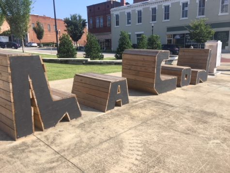 Benches spell out Macon on the corner of 2nd and Poplar street downtown. 
