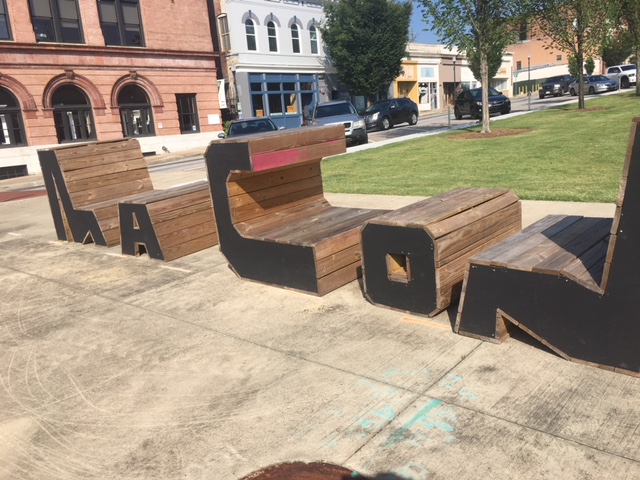 Benches spell out Macon downtown on the corners of 2nd and Poplar street. The benches are regularly moved around the city.