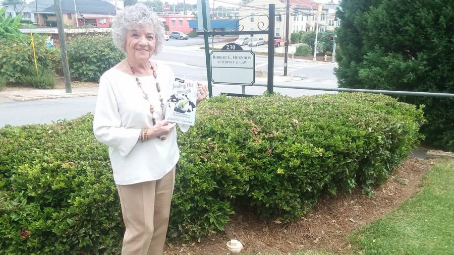 Estelle Herndon is pictured with her book, “Finding His Strength.”