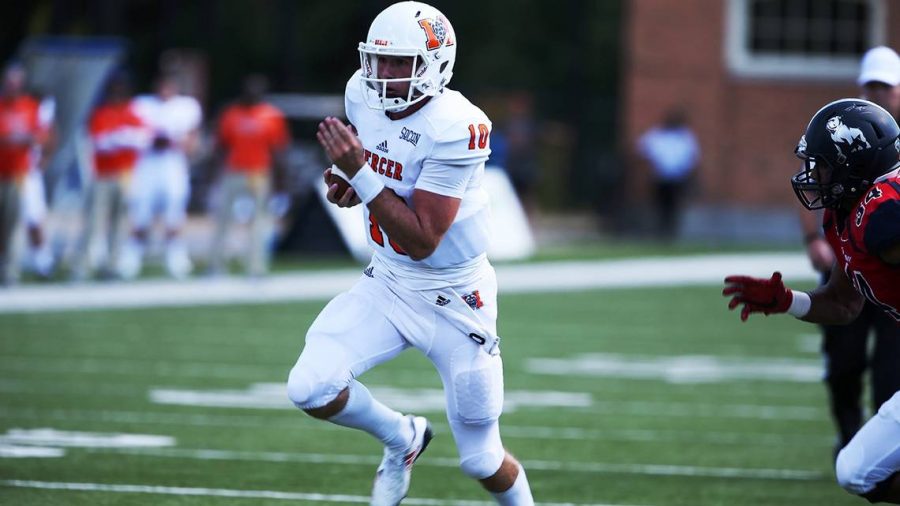 The Mercer Bears quarterback Robert Riddle carries the ball against No. 9 Samford. Riddle was key in leading the Bears to the upset on Saturday.