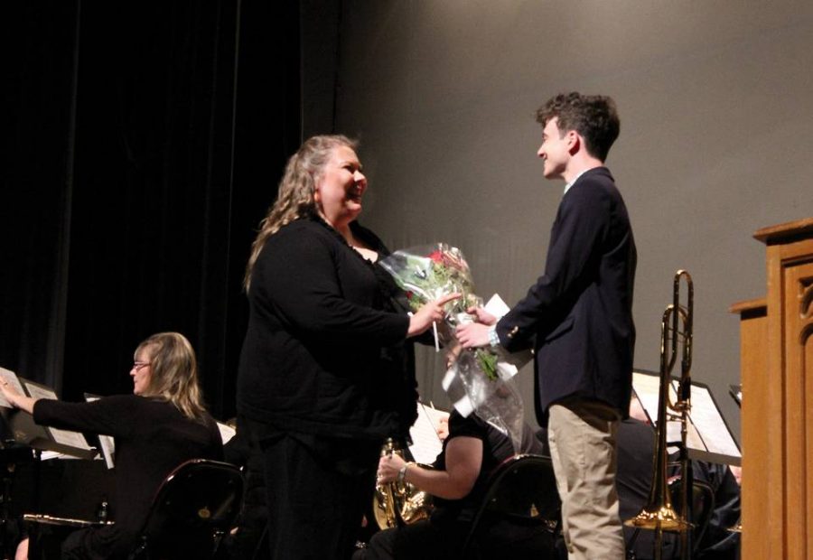 Lori Johnson receives flowers from a student after conducting at the Middle Georgia Concert Band’s performance at Wesleyan College’s Porter Auditorium on March 28, 2019.