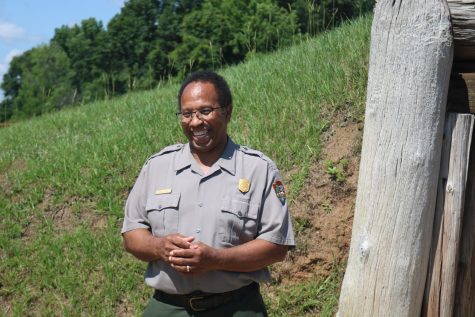 Davis stands outside one of the historical mounds. 