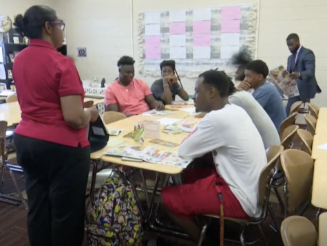 Alicia Mays of UGAs Expanded Food and Nutrition Education Program, teaches Southwest High School boys healthy eating habits.