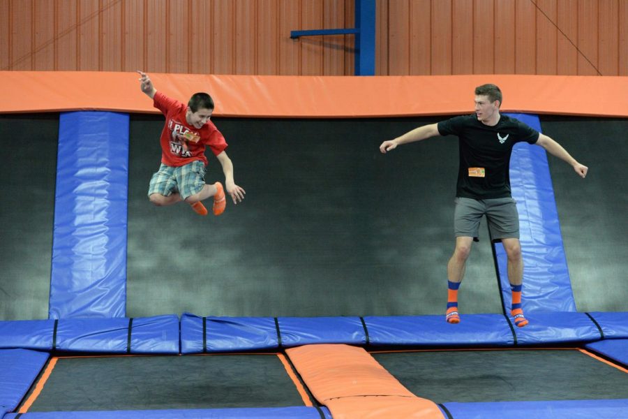 U.S. Air Force Senior Airman Sean Hummel, of the 119th Wing, right, jumps with his ‘little wingman’ Max during an outing at the Sky Zone indoor trampoline park, Fargo, North Dakota, April 16, 2015. Hummel has been mentoring Max for six years and is working on developing a youth mentoring program for members in the 119th Wing through the North Dakota Air National Guard Family Program called the Little Wingman Program. (U.S. Air National Guard photo by Senior Master Sgt. David H. Lipp/Released)