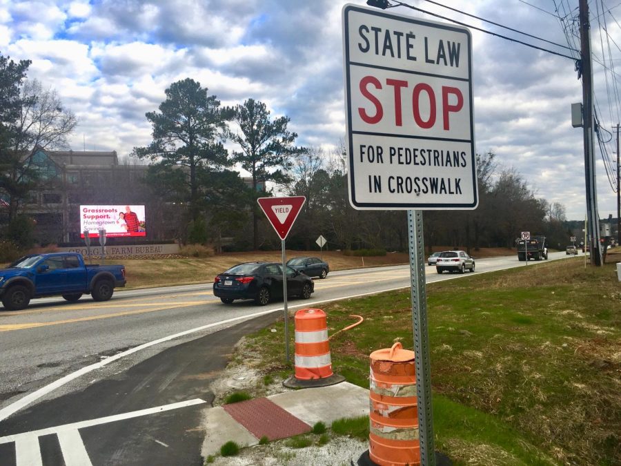 New+pedestrian+crossings+lead+to+a+drainage+ditch+on+Bass+Road+at+the+Interstate+75+off-ramp.