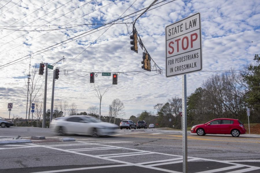 New pedestrian crosswalks at Bass Road and Interstate 75 are part of state safety enhancements but there are no sidewalks on that busy thoroughfare.