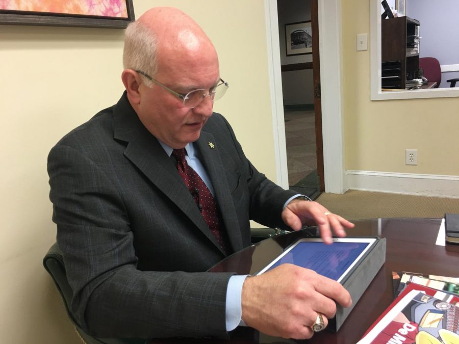 Bibb County Sheriff David Davis checks a spreadsheet before asking for $825,000 to cover this years overtime expenses during Tuesdays Operations and Finance committee meeting at Government Center.