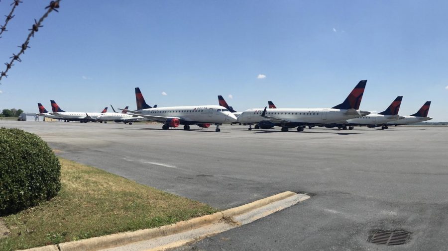 More than a dozen Delta Connection jets from Republic and Compass airlines are parked at Middle Georgia Regional Airport during the COVID-19 pandemic. 