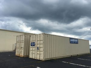 Two rented shipping containers behind the Macon-Bibb County Board of Elections represent just one of the added expenses for the states new voting machines.