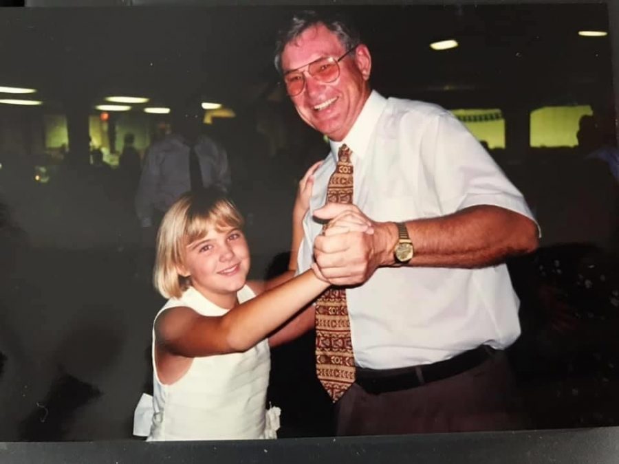 A young Becca Devens and her grandfather, Dr. Lynn Frisbie. Frisbie died this past April. (Photo courtesy Becca Devens)