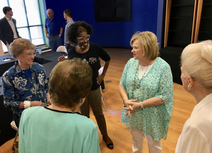 Former Keep Macon Bibb Beautiful CEO Pam Carswell, second from right, speaks with board members at her retirement lunch in June. 