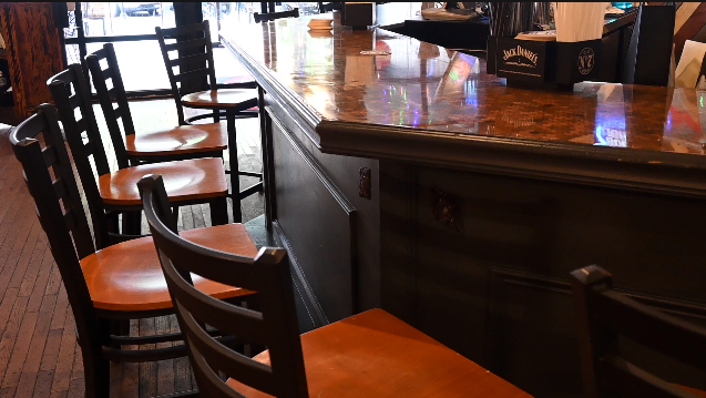 Once full barstools at Parish on 2nd are now empty, as restaurant owners hope more customers will return to dining rooms amid the pandemic.