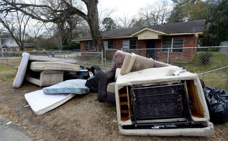 Furniture and other belongings sit at the curb after the Magistrate Court Sheriff’s office supervised a court ordered eviction on Del Park in late January 2019.