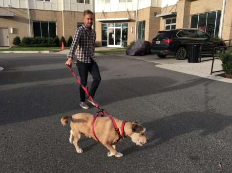 Downtown Macon resident Patrick Cheek takes his dog, Ernie, for a walk near his loft. There are about 600 dogs now living in downtown.