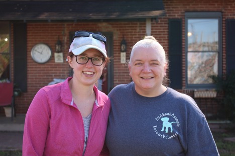 Haylee Robinson and Kristin Wright volunteer at All About Animals, a nonprofit no-kill shelter in Macon, Ga. on Nov. 14. 