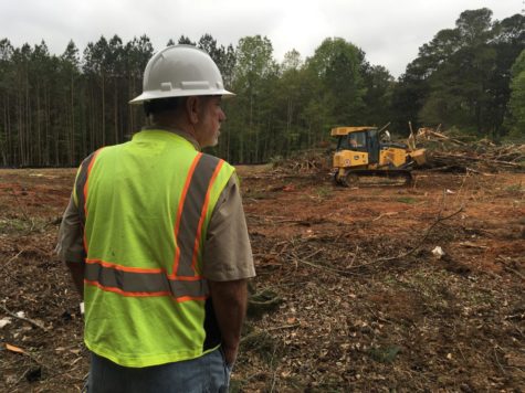 Piedmont Constructions Randall Posey checks progress on clearing land at 3568 Northside Drive for a new senior citizen affordable housing complex. 