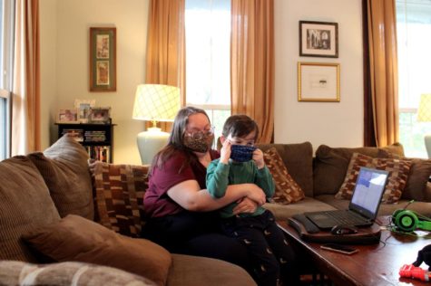 Lane Hinson hugs her son, Lennox, in their home in Macon, Ga. 