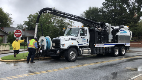 A Macon Water Authority Stormwater Management crew unclogs a storm sewer after flash flooding in Mercer Village last fall. 