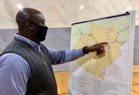 Macon-Bibb Planning & Zoning Commission senior planner Gregory Brown points out pending road projects Monday night at Rosa Jackson Community Center during the first of nine public meetings on local transportation projects. 
