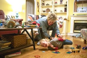 Nancy Masters, 68, tickles her 4-year-old grandson Memphis in their home in Dalton, Ga. on Monday, Feb. 14, 2022. Masters’ son and Memphis’ dad, Joshua Carl Haynes Lester, was fatally stabbed while serving time at Central State Prison in July of 2021. He was supposed to come home in August of 2022. Masters’ now has permanent custody of Memphis and is raising him alone. (Photo by Evey Wilson Wetherbee)