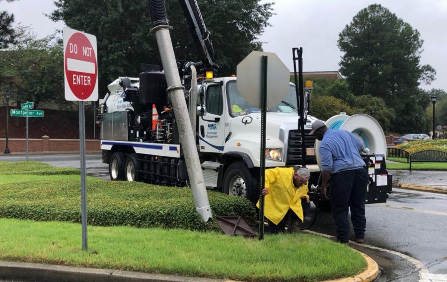 A Macon Water Authority worker climbs out of the storm sewer as the crew works on clearing a storm drain in Mercer Village after flash flooding last fall. The EPD found the Stormwater Management Program to be in compliance for the first time since the county was fined $145,000 for documented deficiencies in 2018. 

