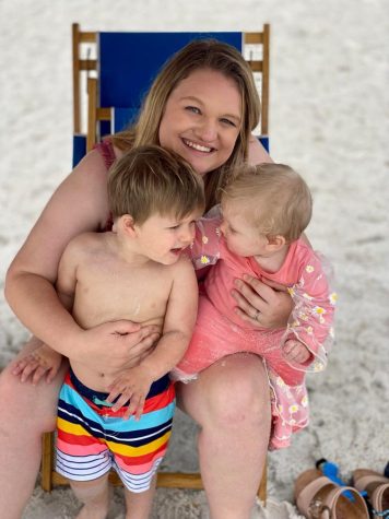 Abbey Patterson holds two year old Stetson and 10 month old Abby Lynn at the beach.