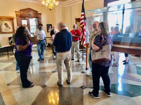 The Macon Water Authoritys Kendra Finney, left, talks with property owners who attended committee meetings at Macon City Hall on May 19. 