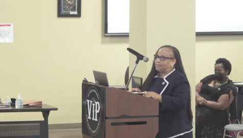 Bibb Schools Chief of Staff Katika D. Lovett presents a proposal to contract with consultant company Gallup Inc.