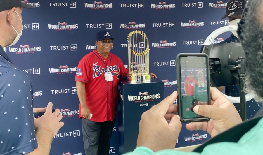 John Rawls, Sr. poses with the Braves World Series Commissioner’s Trophy in downtown Macon, Ga. “It means the world to me,” Rawls said. (Photo by Evey Wilson Wetherbee)