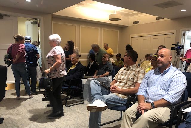 Neighbors in opposition to a proposed business center on Hartley Bridge Road leave Monday's P&Z meeting when the developer asked for an extension to allow time to meet with neighborhood representatives about the project. 