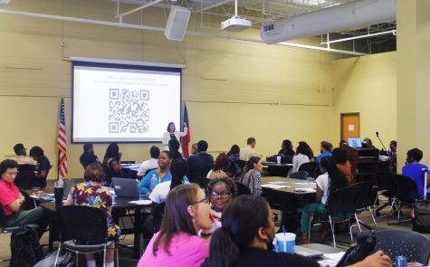 Holly Huynh, talent management coordinator for Bibb Schools, welcomes new teachers at the first monthly professional learning night of the school year Sept. 8, 2022. About 170 teachers attended and all were recent career changers.