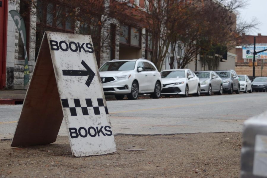 A sign points the way to Golden Bough Bookstore. 