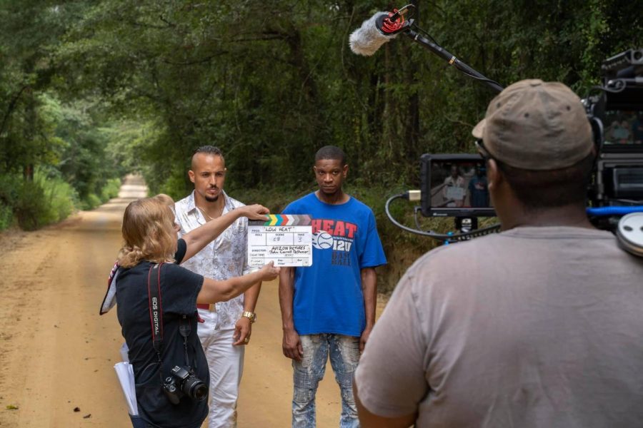 Slating during the filming of “Low Heat,” a Middle Georgia indie film. On her side, Wilson carries a camera she said is for stills and continuity while filming, with a copy of the shot list in her back pocket. (Photo submitted by Terry Wilson).