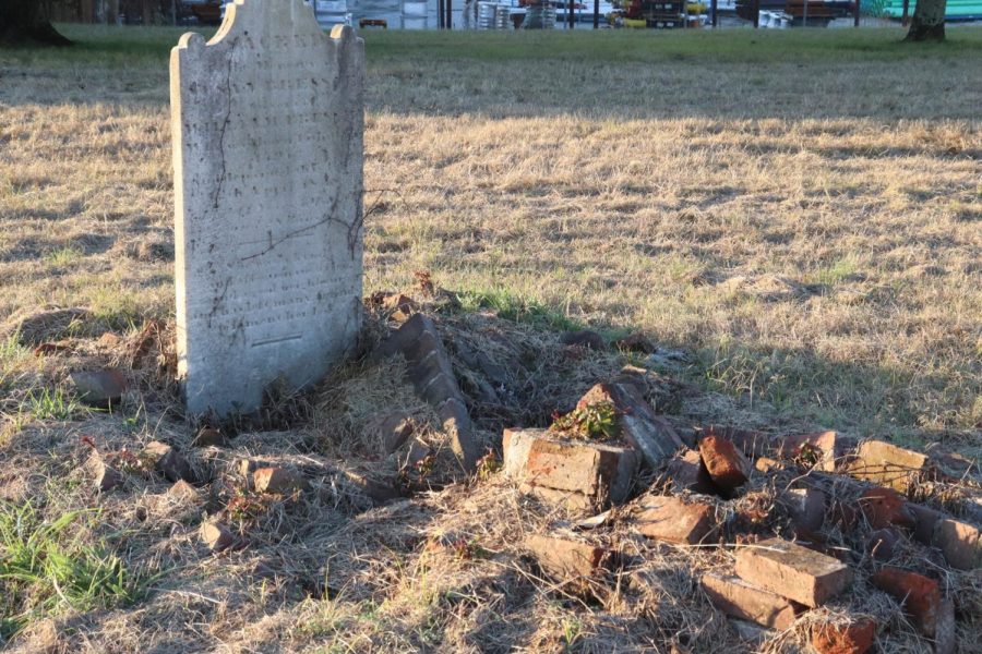 This is a sunken grave covered with bricks on Nov. 30, 2022. The name, like many others, on this gravestone has faded to the point where it cannot be read. 