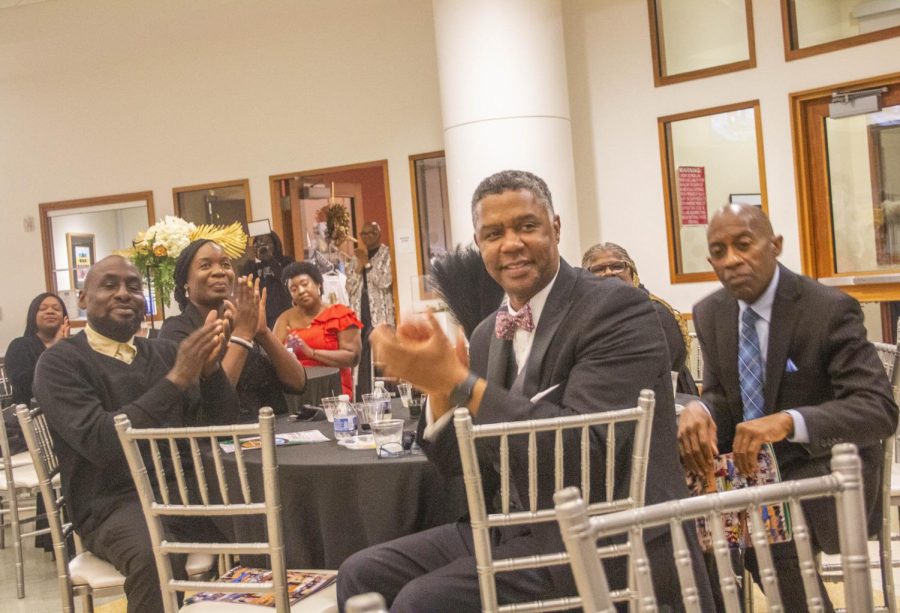 Rep. James Beverly, D-Macon, right, applauds a speaker at the black-tie fundraising gala for the Macon-Bibb Community Enhancement Authority in the rotunda of the Tubman African American Museum on Oct. 29, 2022.