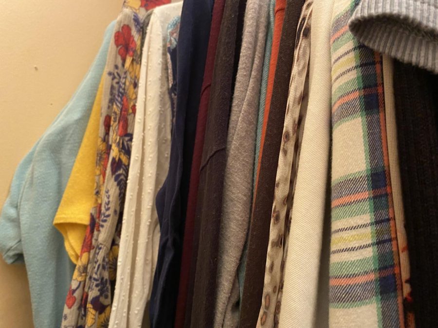Clothing on a rack in closet