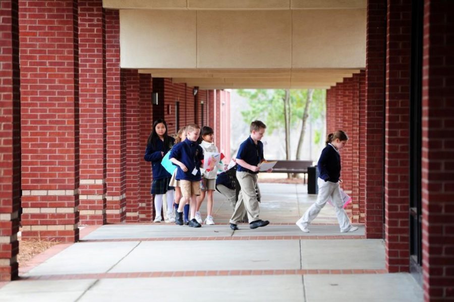 WOODY MARSHALL/THE TELEGRAPH
Macon, Georgia, 02/09/2015:
Academy for Classical Education students walk to lunch Monday morning.