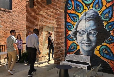 The Reimagining the Civic Commons Studios art walk through downtown included the Flannery O’Connor mural outside the Quill bar of the Woodward Hotel.  