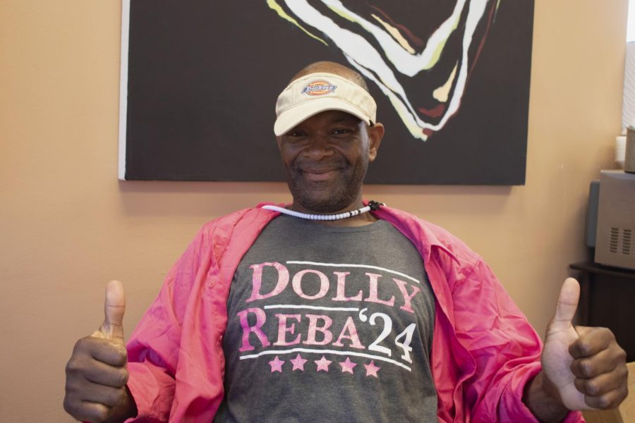 Sean Latterhail Stephens showing off his Dolly Parton shirt after an interview at the Daybreak Center on April 20, 2023. Sean has been volunteering at Daybreak for three years, even though he lives in a boarding house himself.