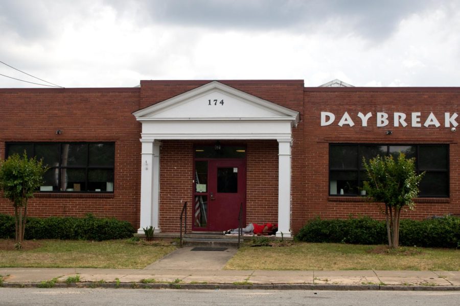 A homeless person sleeps on the front porch of Depaul USA Daybreak Resource Center in Macon, Ga. The center closes at 3 p.m. and reopens at 7:30 a.m. daily.