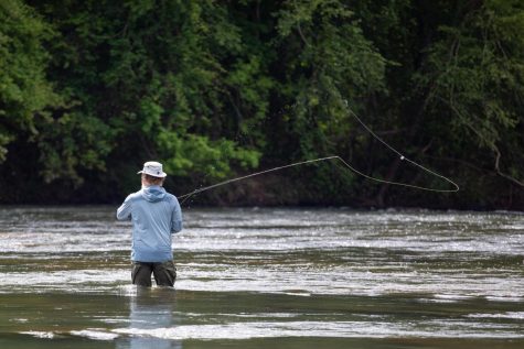 James Shelton cast a fishing line during a fly fishing trip on the Ocmulgee River in Juliette, Ga on April 24, 2023.