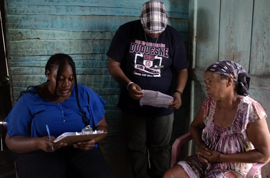 Fatoumata Keita, a Mercer engineering student, surveys a member of the Siembra Vieha neighborhood in El Cercado, Dominican Republic on June 6, 2023. Students walked door-to-door, talking with community members as part of their research. 