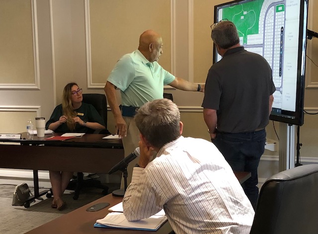 Macon-Bibb County Planning & Zoning Commissioner Tim Jones questions developers about planned amenities in a proposed residential cluster development off Jennifer Drive. 
