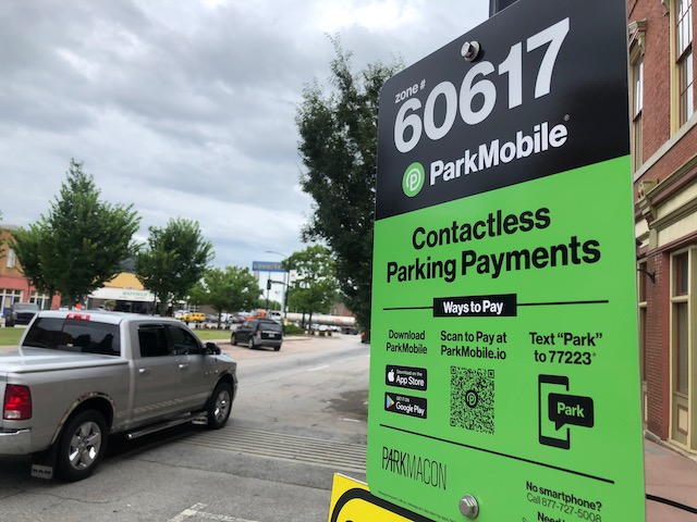 Park Macons new green signs provide digital payment instructions and also provides a toll free number for those without a smartphone. The meters still take coins, too. 