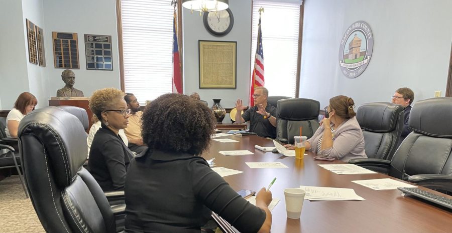 Peachtree Recovery Services Vice President Todd Rhoad, second from left, presents 
a report on pedestrian hotspots in Macon to a few members of the Macon-Bibb Pedestrian Safety Review Board who attended the monthly meeting in June 2023.