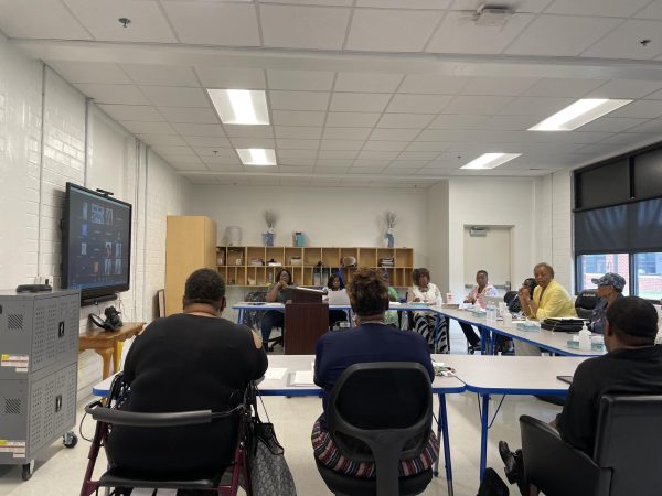 Cirrus Academy employees attend the governing board meeting on July 18, 2023, in person as governing board members conducted business via Zoom.