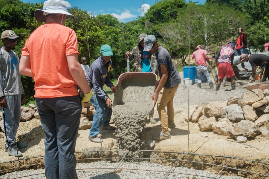 Felix Manuel del Jesus Minyety (right) is a Dominican Republic engineer who specializes in construction of stone water tanks.