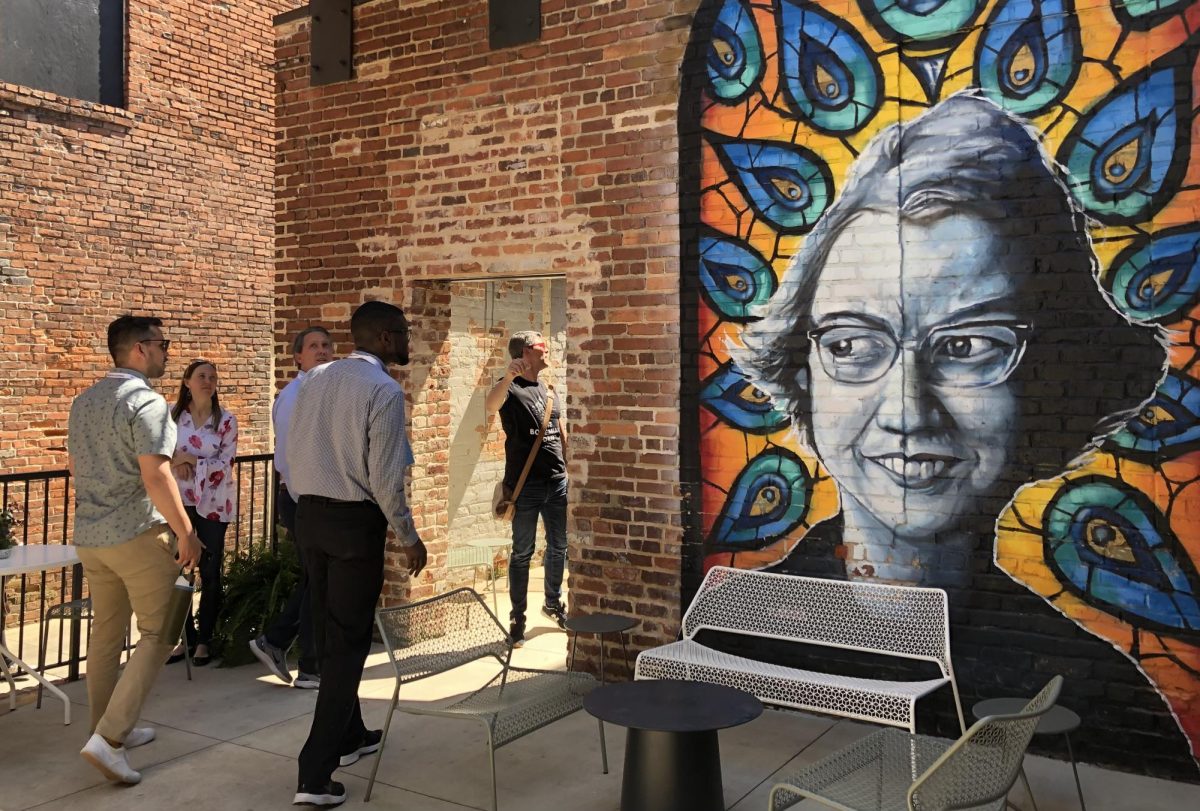 Kevin Scene Lewis portrait of Flannery OConnor outside the Quill lounge at the Woodward hotel is one of a growing number of murals in downtown Macon. 