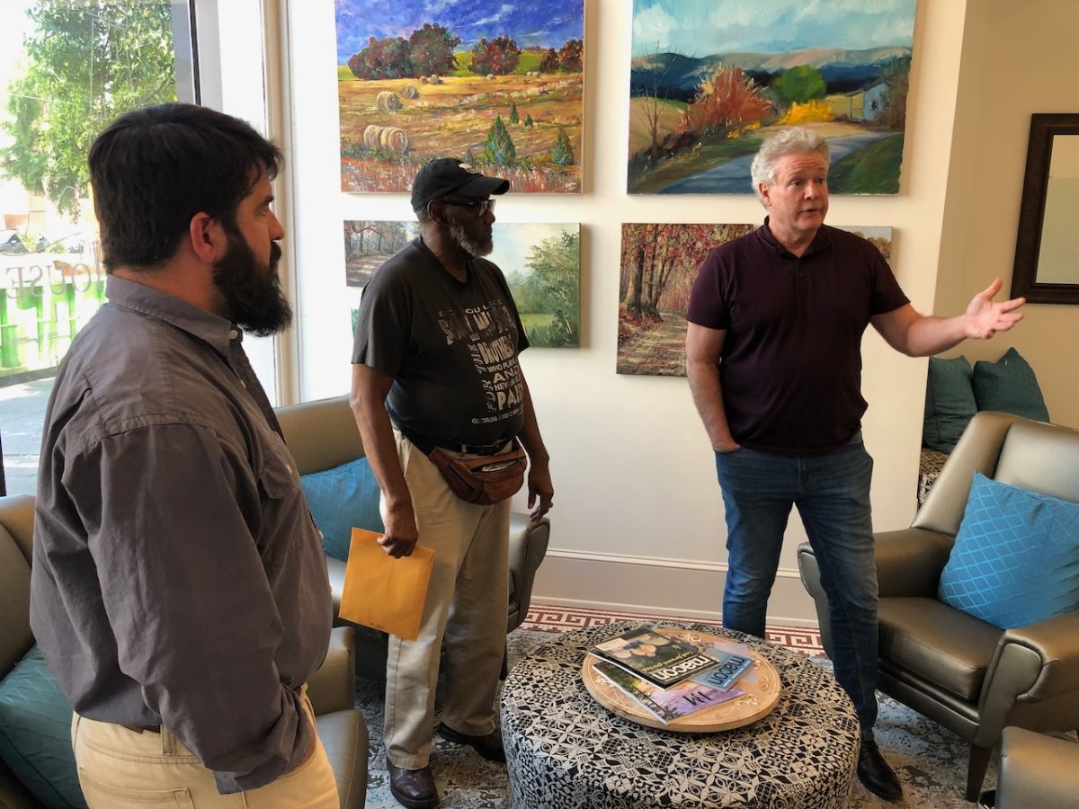 Actor and playwright Michael OLeary, right, discusses his play Breathing Under Dirt with Joshua Hale, left, and Newton Collier at the Griffith Foundation headquarters on Mulberry Street in April. 